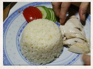 Recipe Hainan Chicken Rice; add sliced meat on the plate